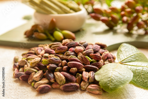 Sweet, delicate and fragrant nuts, Bronte pistachios with  brilliant green colour, ingredient for Italian cuisine, ice creams, cakes, pesto