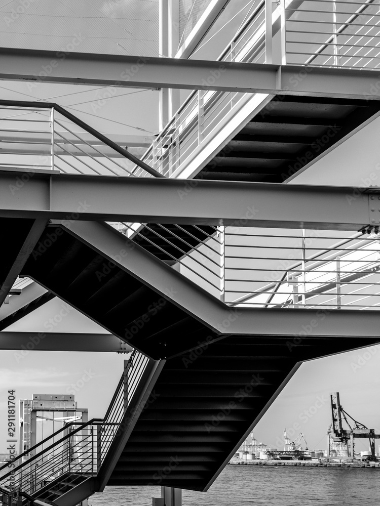 Fototapeta premium Black and white stairs with shadows and light abstract view