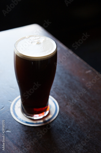 Pint of dark beer. photo