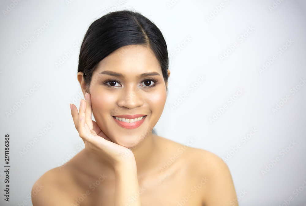 PoBeautiful Young Woman with Clean Fresh Skin touch own face . Facial treatment. Cosmetology , beauty and spa against white backgrourtrait Of Shirtless Woman with clear skin care Over white Background PoBeautiful Young Woman with Clean Fresh Skin touch own face . Facial treatment. Cosmetology , beauty and spa against white backgrourtrait Of Shirtless Woman with clear skin care Over white Background