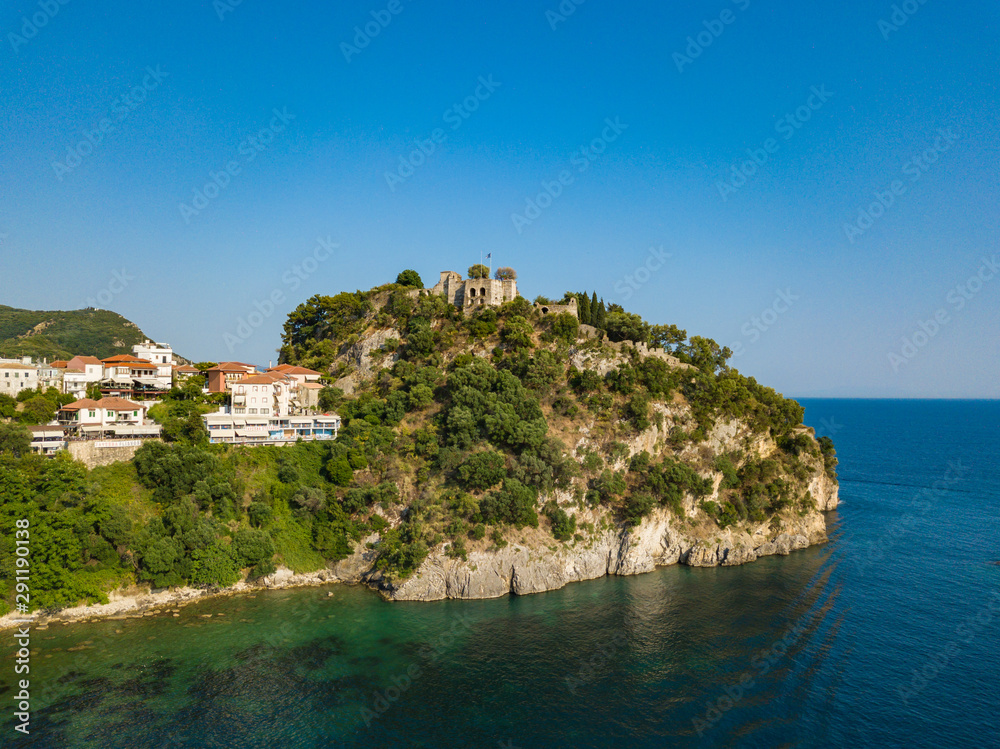 Aerial drone view to historical castle of Parga. Located on the top of a hill overlooking the town. Greece