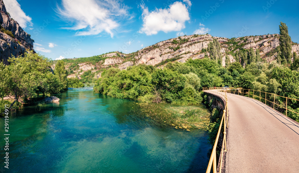 Sunny summer view of Roski Slap village. Splendid morning scene of Krka National Park, Croatia, Europe. Beautiful world of Mediterranean countries. Traveling concept background. Sunny summer view of Roski Slap village. Splendid morning scene of Krka National Park, Croatia, Europe. Beautiful world of Mediterranean countries. Traveling concept background.