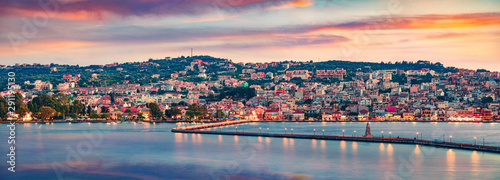 Panoramic evening cityscape of Argostolion town, former municipality on the island of Kefalonia, Ionian Islands, Greece. Dramatic spring seascape of Ionian Sea. Traveling concept background. photo