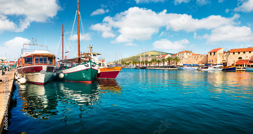 Panoramic summer cityscape of Trogir town. Colorful morning seascape of Adriatic sea. Beautiful world of Mediterranean countries. Traveling concept background.