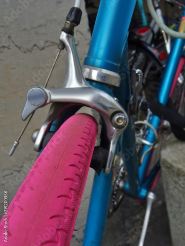 Close-up of a colorful bicycle parked in the city. Urban mobility. environmental footprint