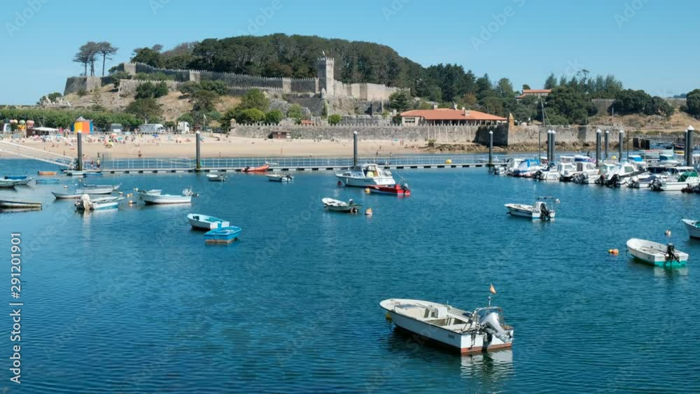 Boats in Baiona Harbour and Fortress in Background