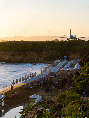 sunset over ammes beach and kefalonia airport photo