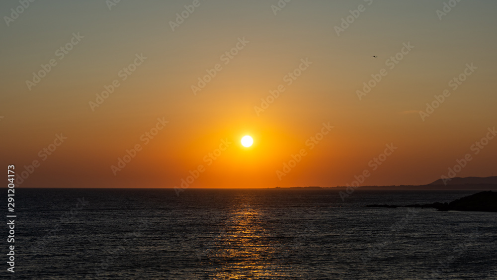 orange greek sunset on beach