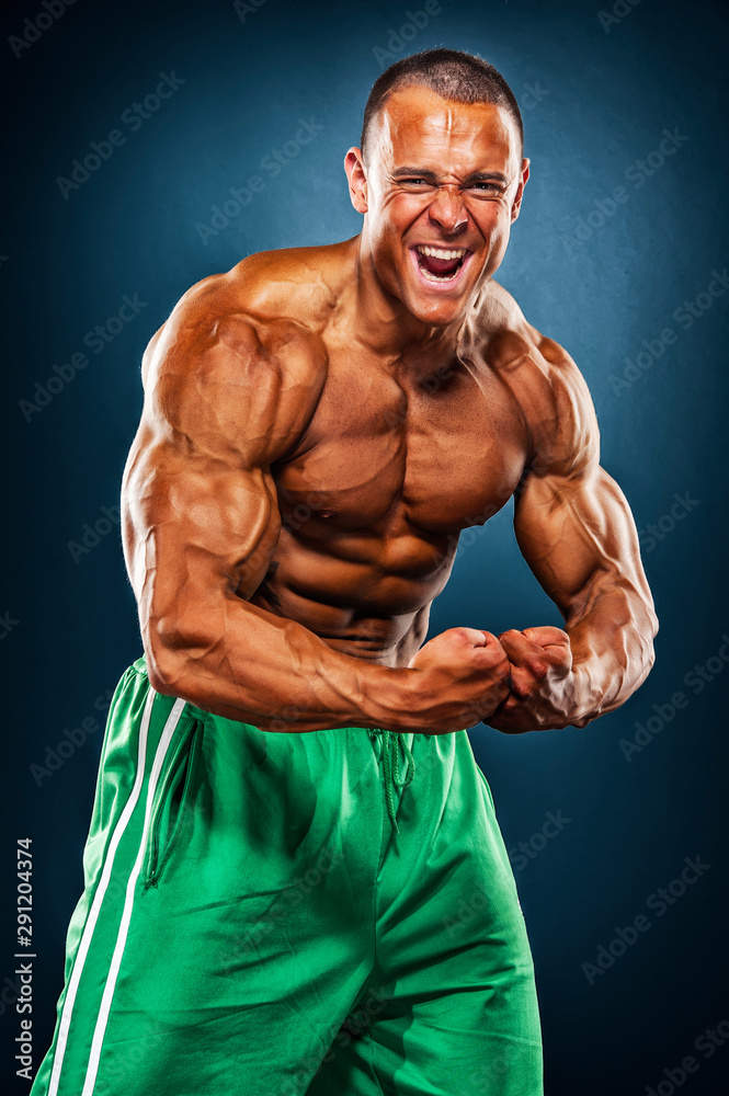 Handsome, Strong BodyBuilder Flexing Muscles