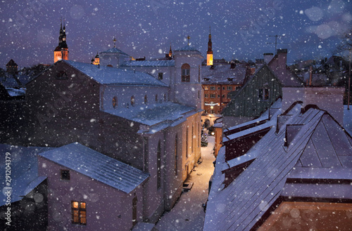 dormer and roofs of a medieval city in winter