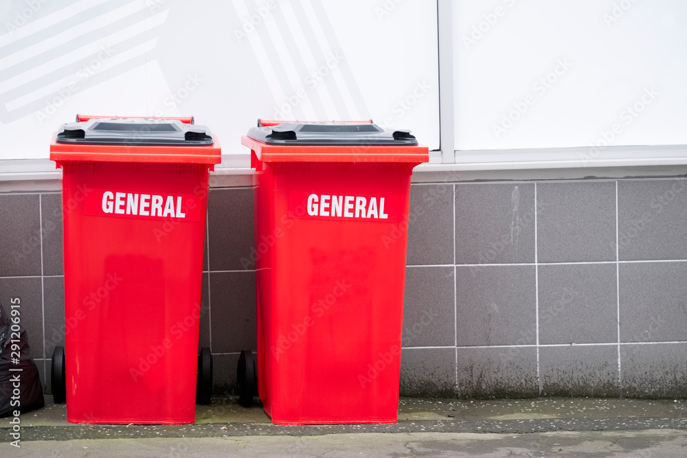General waste red recycle wheelie bins in England UK outside hospital General waste red recycle wheelie bins in England UK outside hospital