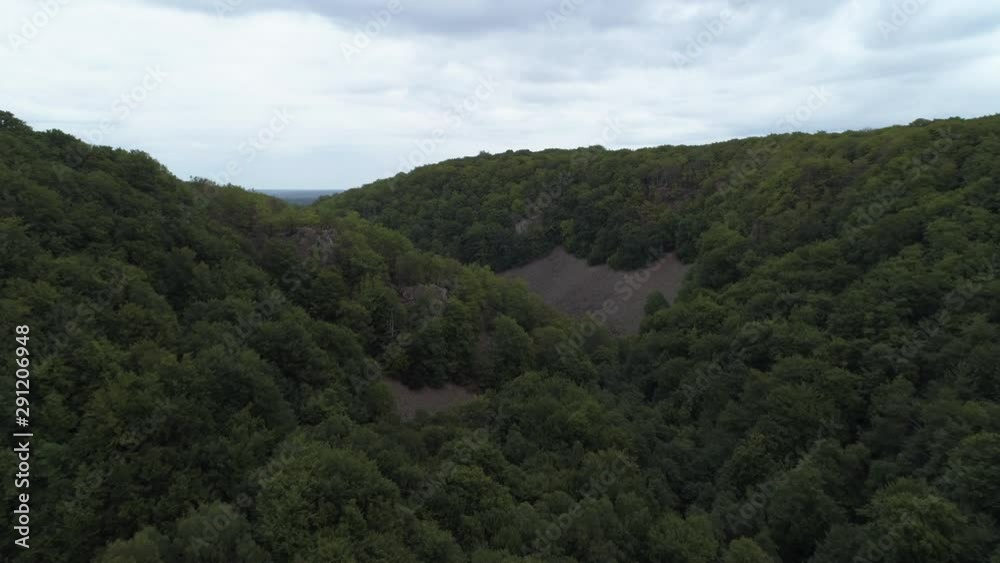 Aerial view of tree tops and mountain valley in national park. Drone shot flying over forest landscape in Southern Sweden, Skåne. Nature background in 4K resolution Aerial view of tree tops and mountain valley in national park. Drone shot flying over forest landscape in Southern Sweden, Skåne. Nature background in 4K resolution