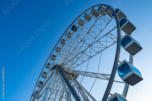 Ferris Wheel in Helsinki. Finland. Rest in an amusement park. Cabins ferris wheels. Amusement park. Entertainment in the city of Helsinki. Ferris wheel bottom view. Attractions close up.