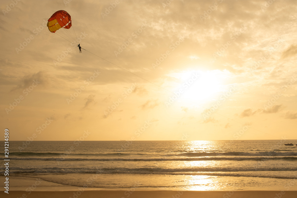 Parasailing vacation in the sea and sun set at phuket thailand