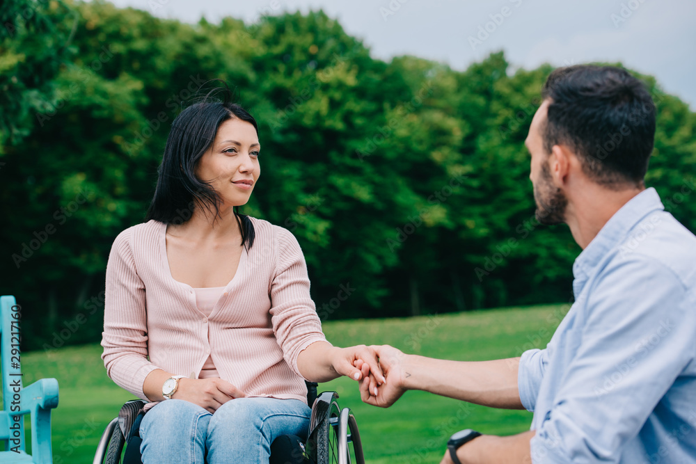 custom made wallpaper toronto digitalhappy disabled woman holding hands with boyfriend while resting in park together