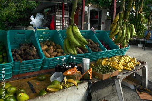 Fruit Stand in San Juan Puerto Rico with a variety of fresh produce for sale including plantains, mangoes and bananas