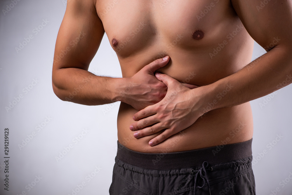 Naklejka premium Young man suffering from stomachache