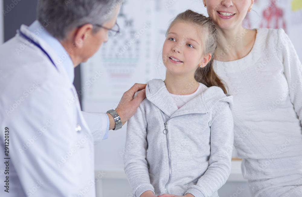 Little girl with her mother at a doctor on consultation Little girl with her mother at a doctor on consultation