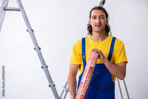 Young man contractor doing renovation at home