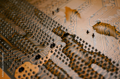 A Orange colour waterproof water resistant Printed Circuit Board with CPU  SMD   IC mounted part on board