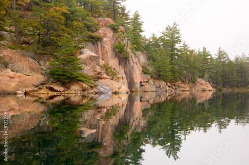 Shore of Killarney Lake in overcast day..