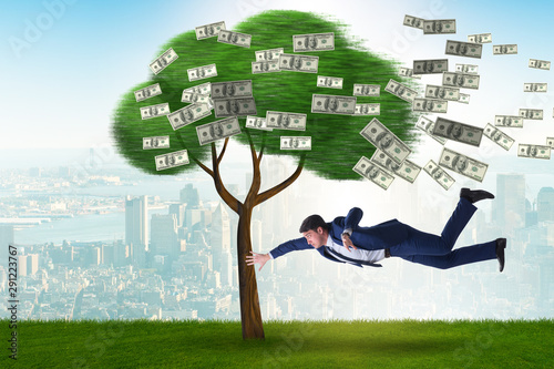 Bilde på lerret Businessman blown away from the money tree