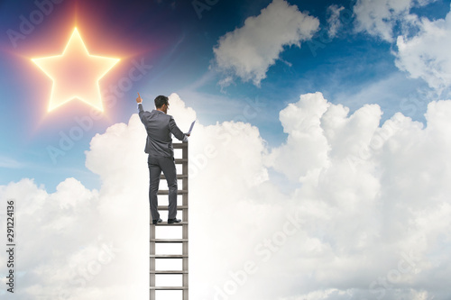 Businessman reaching out for stars