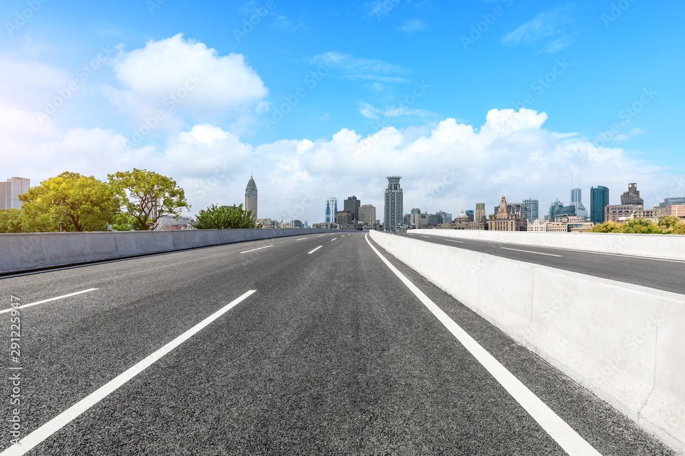 Empty asphalt highway and city skyline with buildings in Shanghai,China.