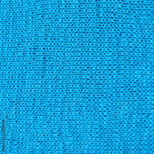 The texture of the knitted fabric. Knitted fabrics. Background of a knitted fabrics.