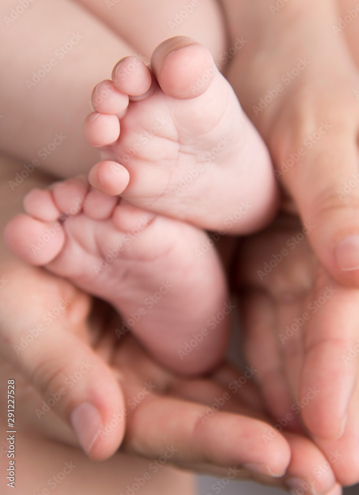 Baby feet in mother hands. Baby feet in mother hands.