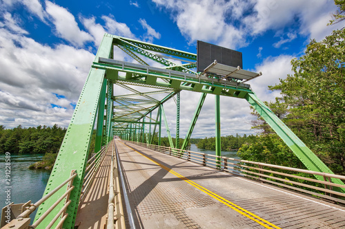 Saint Lawrence River bridge crossing from 1000 islands in Ontario, Canada to USA, New York photo