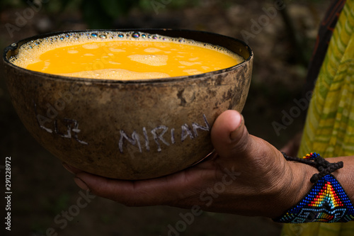 Indigenous traditional beverage called Chicha made of an amazon fruit photo