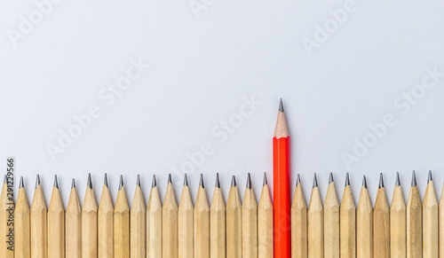 Different pencil standout from the others showing concept of unique business thinking different from the crowd and special one with leadership skill.