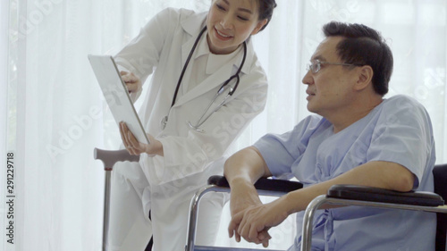 Doctor or physician take care of sick patient at the hospital or medical clinic. The happy patient visit doctor and discuss for illness cure treatment. Medical healthcare and doctor service concept.