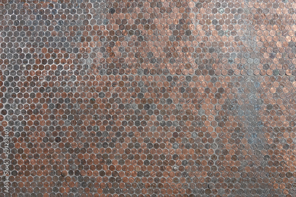 Fototapeta premium Hundreds of American copper pennies are shown as a flat wall background.