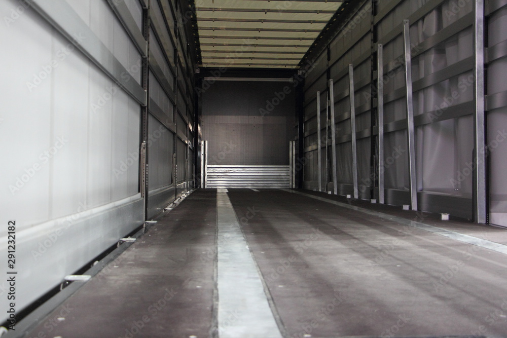 New empty semi trailer interior rear view close-up, truck transportation logistics