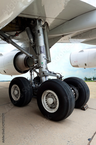 Close up of airplane wheel parked at the airport.