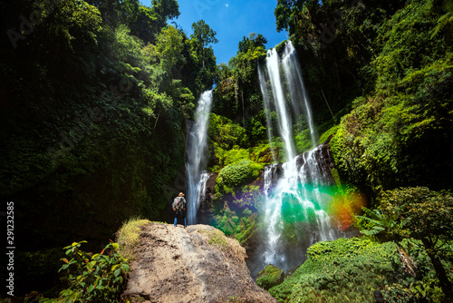 A traveller atand on the rock in Sekumpul waterfall