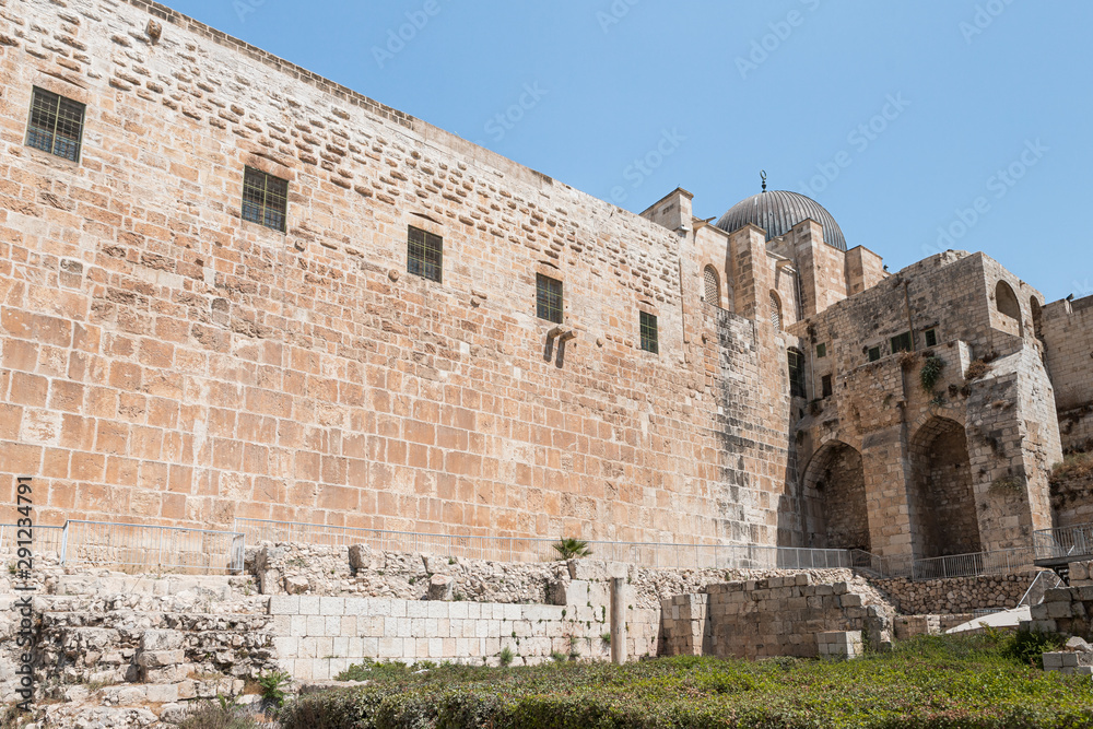 Part of the wall of the temple mountain and the dome of the Al Aqsa Mosque near the Dung Gate in the Old City in Jerusalem, Israel