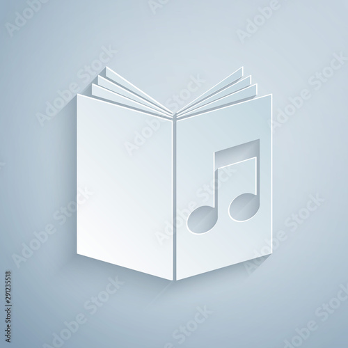 Paper cut Audio book icon isolated on grey background. Musical note with book. Audio guide sign. Online learning concept. Paper art style. Vector Illustration