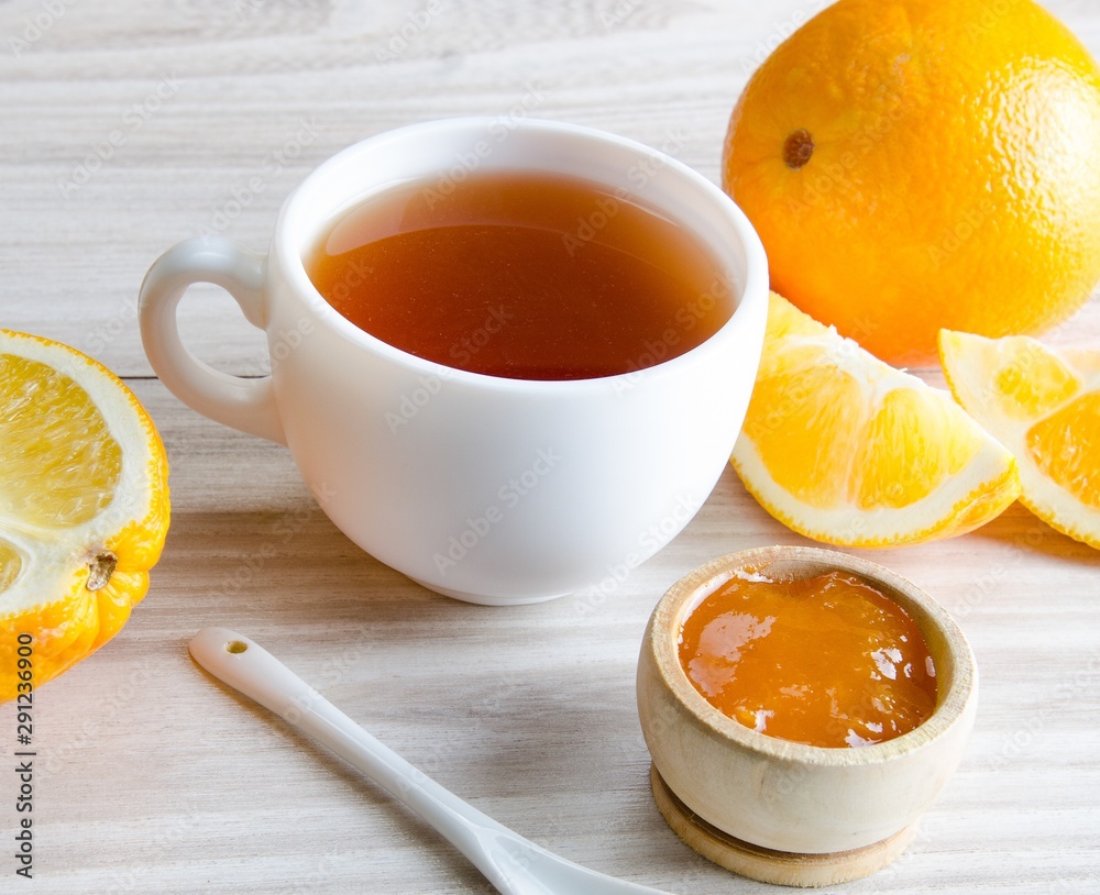 Cup of tea served with orange jam Cup of tea served with orange jam