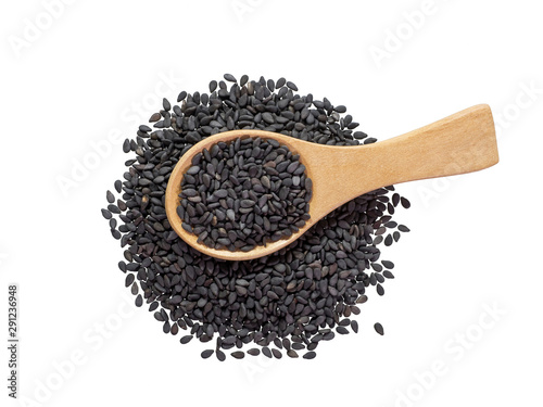 Black sesame seeds in wooden spoon and spread isolated on white background.Scientific name is Sesamum orientale L.Herb.top view.