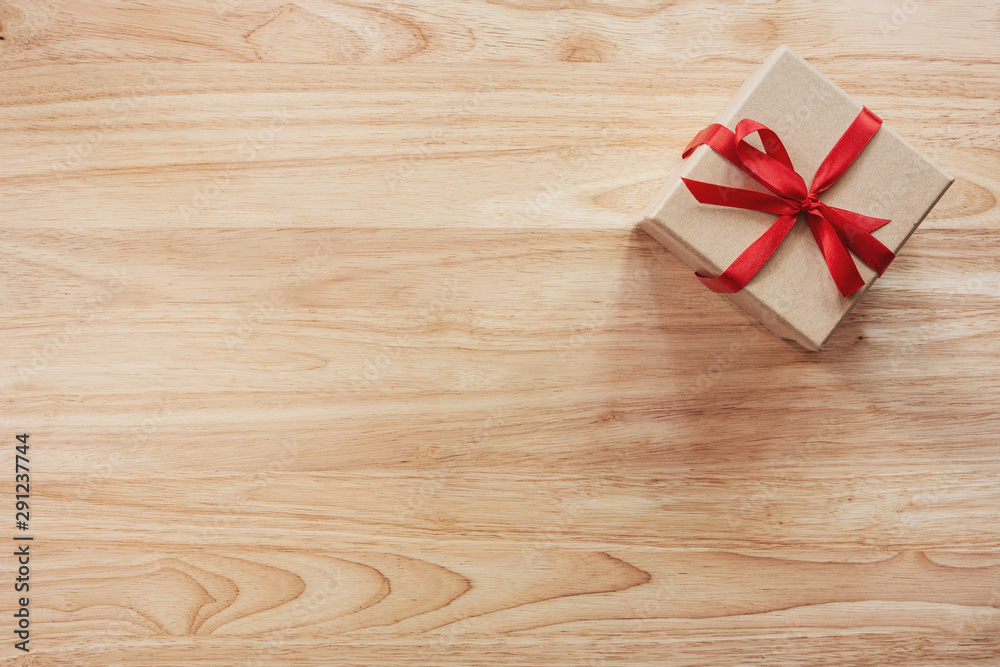 Brown gift box on wooden table background with copy space Brown gift box on wooden table background with copy space