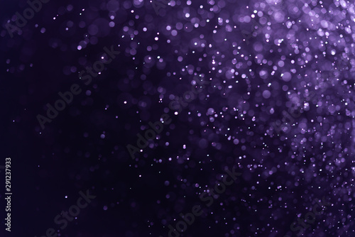 Abstract Purple bokeh defocus glitter blur background.