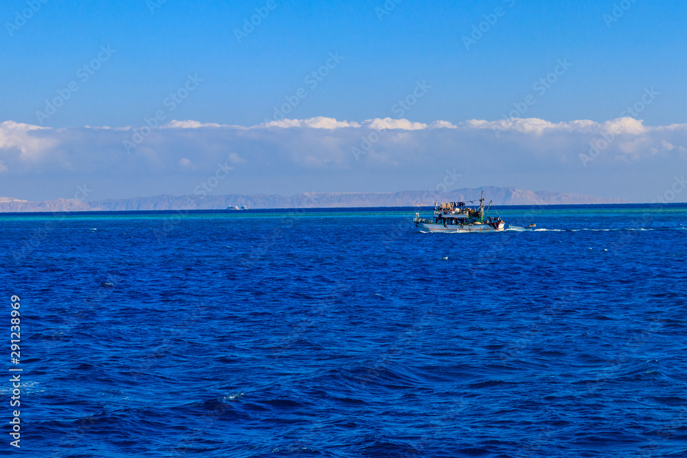 Fishing trawler sails at Red sea in Hurghada, Egypt