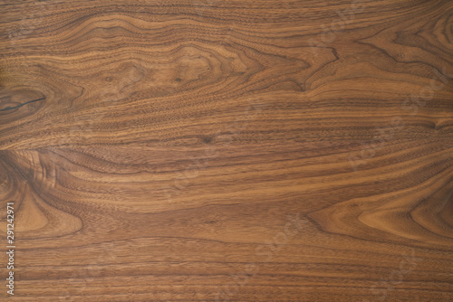 Texture of black walnut table from three boards with oil finish