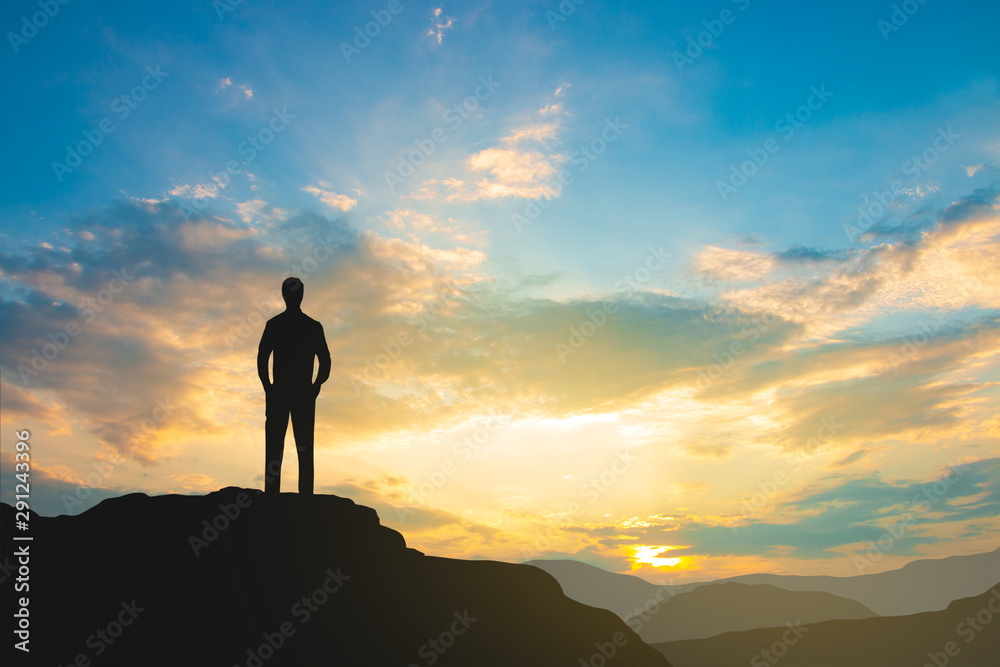 silhouette of man on mountain top over sky and sun light background,business, success, leadership, achievement and people concept silhouette of man on mountain top over sky and sun light background,business, success, leadership, achievement and people concept