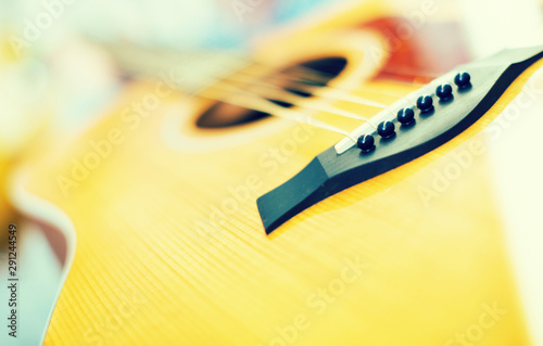 close up of wooden body of guitar photo