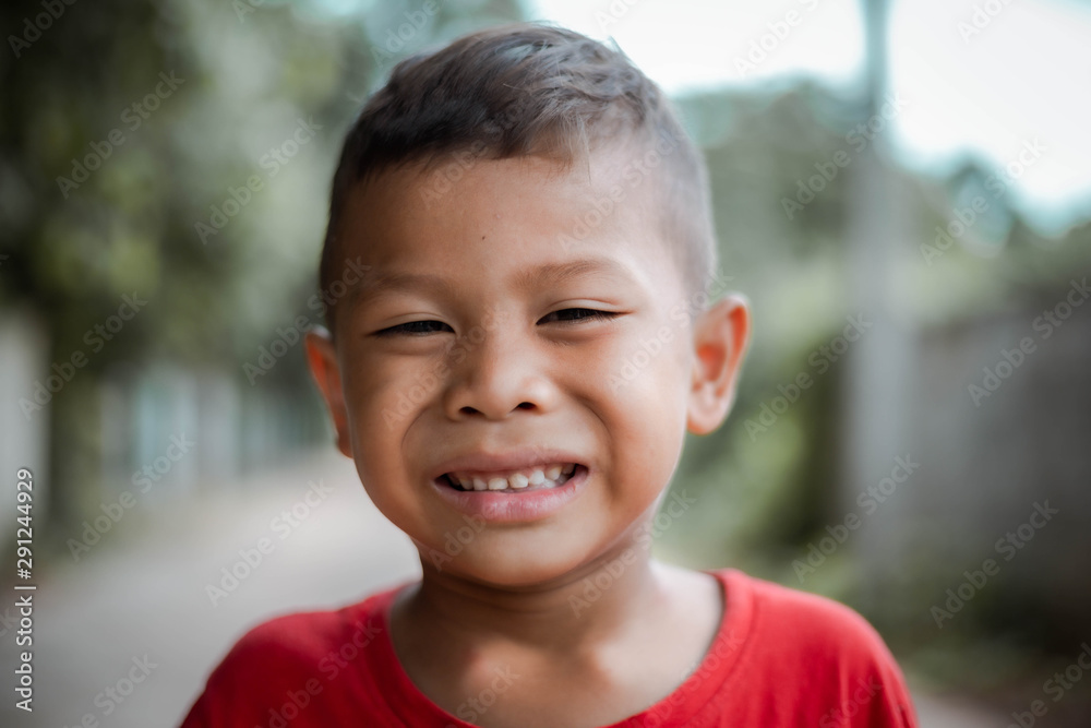 asian boy is smiling on nature background he is happy a day asian boy is smiling on nature background he is happy a day