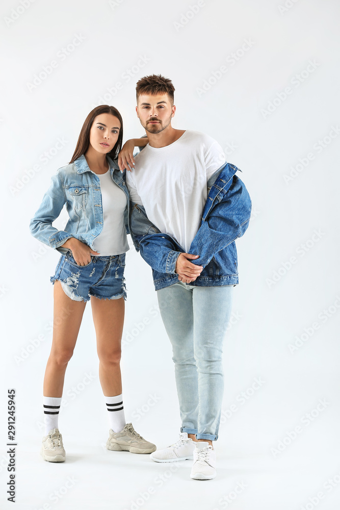 Fashionable young couple on white background Fashionable young couple on white background